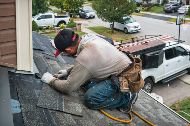 Professional Roofing technician working in Lane, KS
